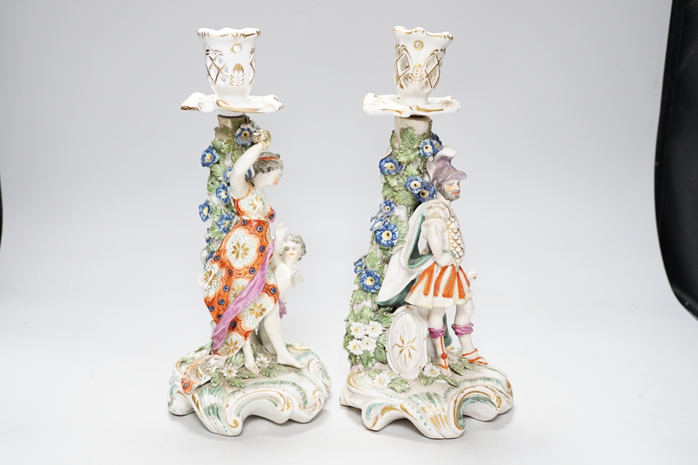 A pair of 18th century Derby figural candlesticks, 29cm